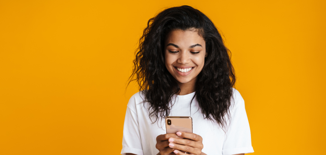 happy customer looking at her phone