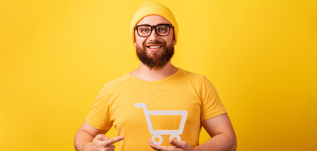 man holding a shopping cart on a yellow background